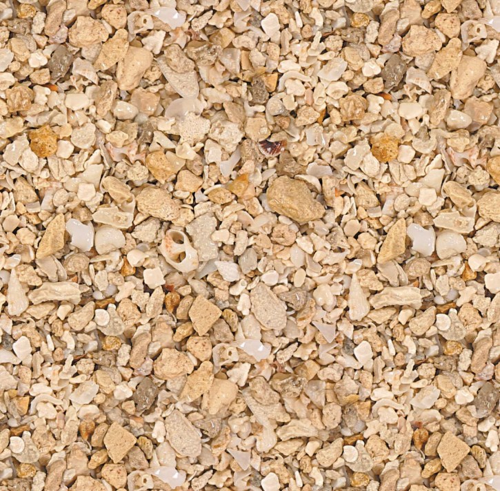 Fiji Pink vs. Oolite: Choosing the Best Marine Aquarium Sand Type 8 A close-up texture of CaribSea Crushed Coral marine substrate, highlighting the coarse aragonite and broken shell fragments used in high-flow saltwater aquariums.