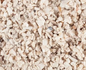 Fiji Pink vs. Oolite: Choosing the Best Marine Aquarium Sand Type 6 A close-up texture of CaribSea Natural Reef marine sand, displaying a realistic blend of varied aragonite grains and small shell fragments used as substrate in saltwater aquariums.